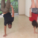 hand stands with my sister 