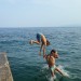 Enoyin jumping with son.