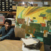 Panos with one of his paintings.