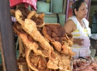 Chicharones on top of raw meat