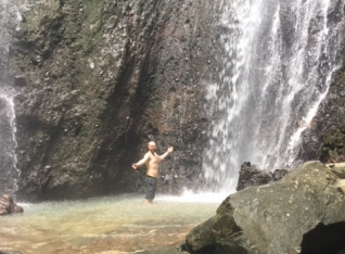 Mark showering in the cold waterfall