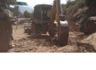 The bulldozer flattening the area