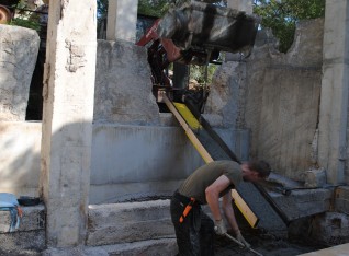 Pouring concrete in the gutter