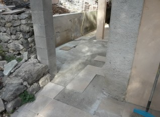 Repair of tiles behind our house