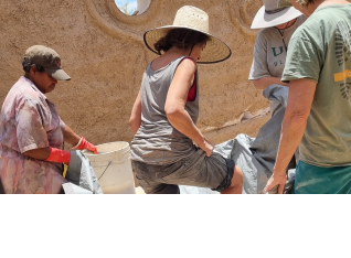 Divina, a barefoot Lafae, Eli and Missy helping out with mud and straw mix.